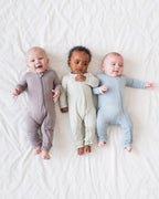 Babies wearing gray, mint and light blue zip-front rompers
