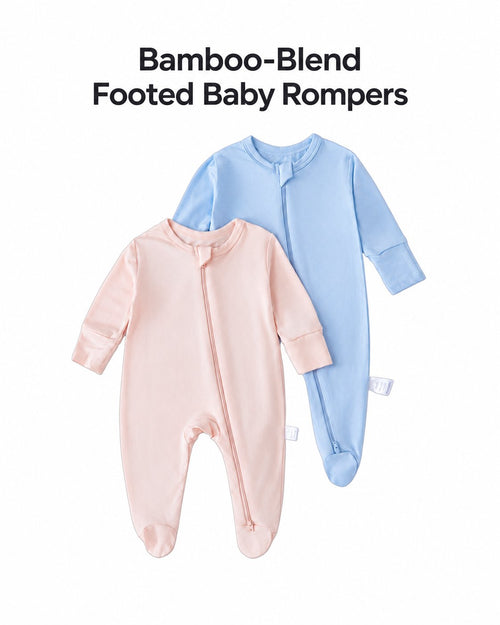 Blush pink and light blue bamboo-blend footed baby rompers with an English heading