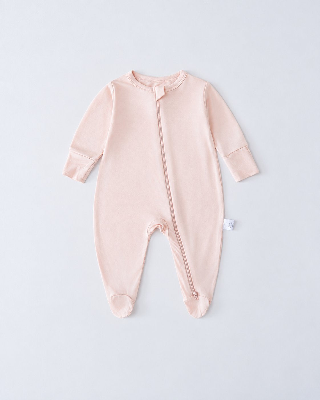 Blush Pink bamboo-blend footed baby romper with long sleeves and a two-way zipper