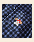 Embroidered dog with red glasses on the blue plaid pajama chest pocket