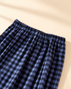 Elastic waistband on the blue and black plaid pajama pants