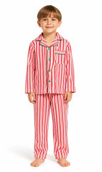Boy wearing red and white vertical-striped button-up pajamas with green piping and buttons.