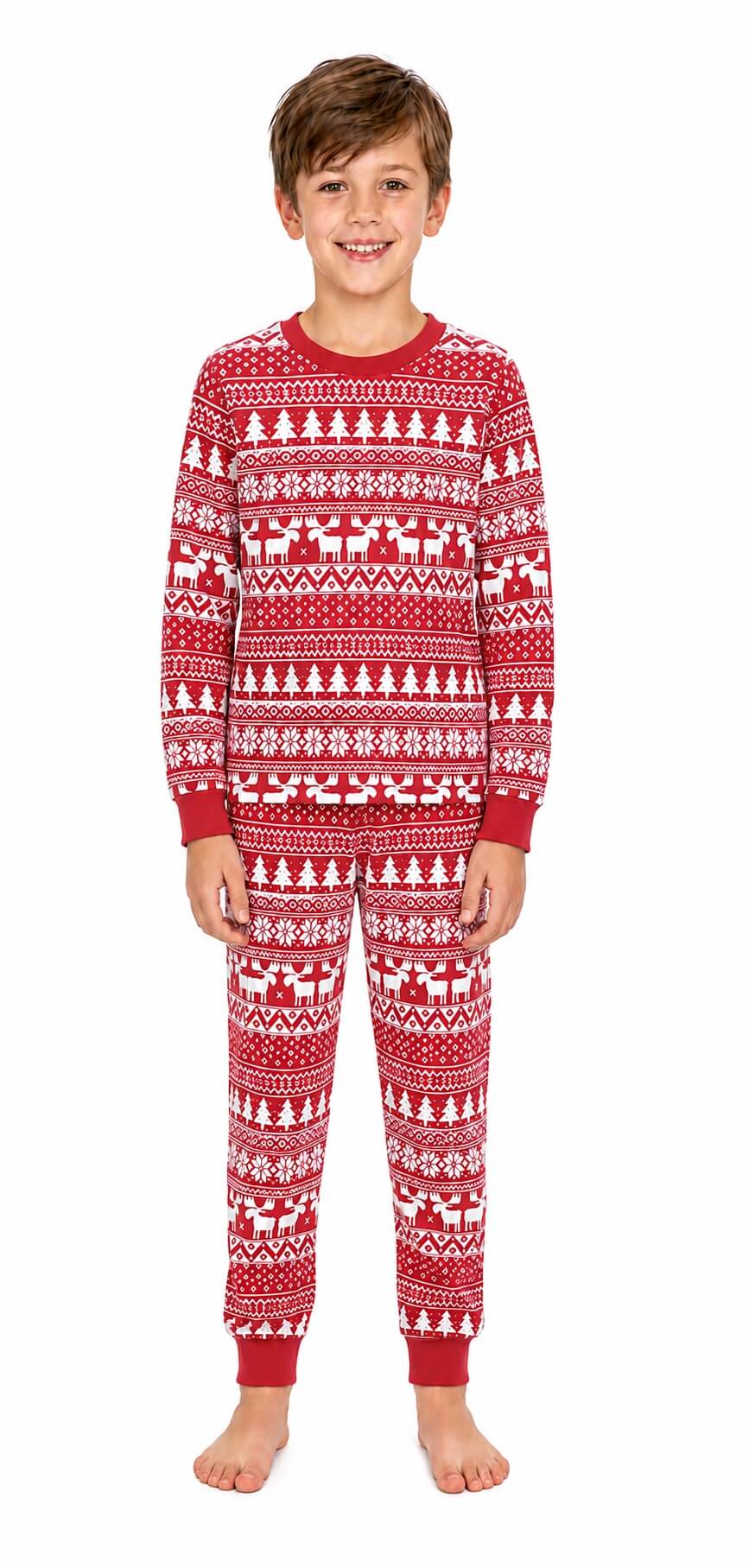 Boy wearing red Christmas pajamas with white trees, reindeer, snowflakes and red ankle cuffs.