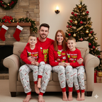 Family seated on a sofa in red Grinch slogan tops and light gray printed Christmas pajama pants
