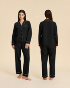 Women's black pajama set with white piping, front and back views