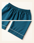 Elastic waistband and white piping hem details on the deep sea blue pajama pants