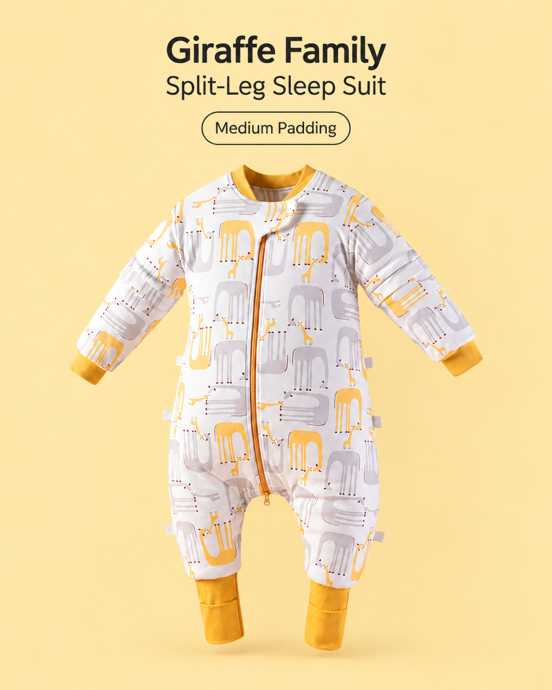 Medium Padding split-leg baby sleep suit in Giraffe Family print featuring yellow and gray giraffes with mustard cuffs, a front zipper and detachable sleeves