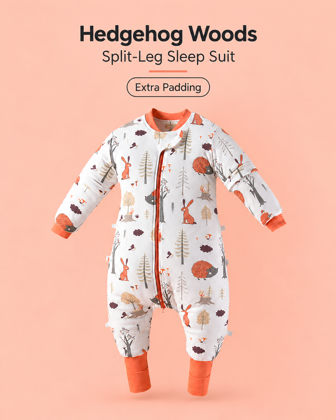 Extra Padding split-leg baby sleep suit in Hedgehog Woods print featuring hedgehogs, rabbits and woodland trees with orange cuffs, a front zipper and detachable sleeves
