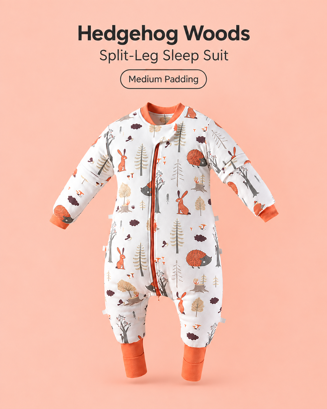 Medium Padding split-leg baby sleep suit in Hedgehog Woods print featuring hedgehogs, rabbits and woodland trees with orange cuffs, a front zipper and detachable sleeves
