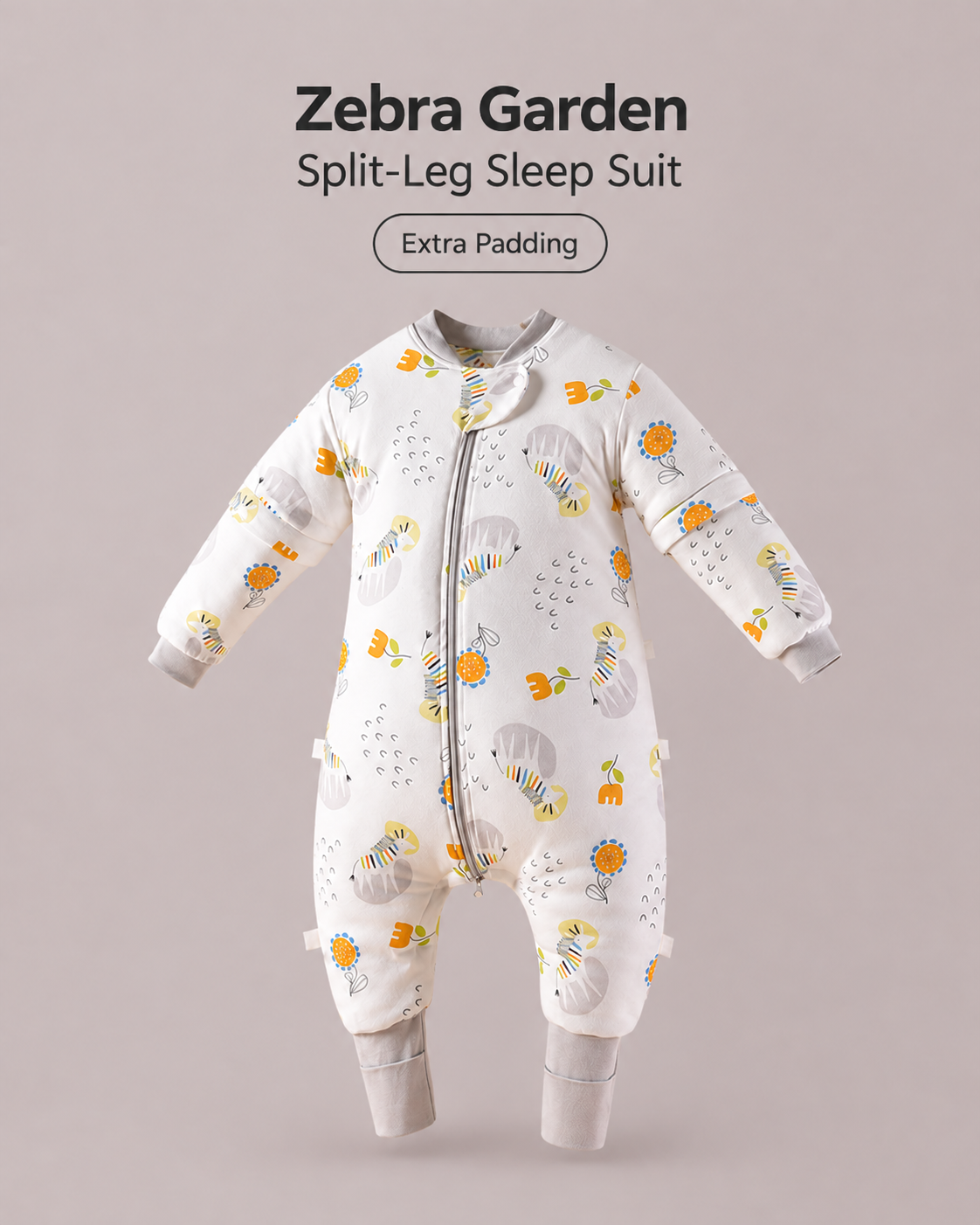 Extra Padding split-leg baby sleep suit in Zebra Garden print featuring zebras and flowers with gray cuffs, a front zipper and detachable sleeves