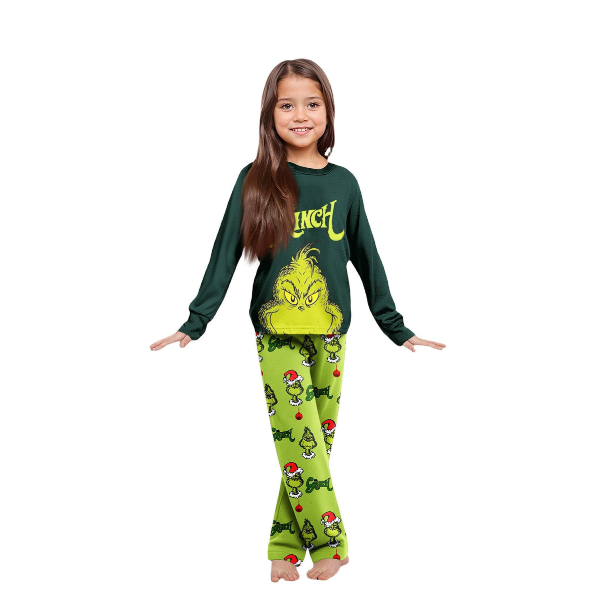 Girl wearing a dark green Grinch graphic top and lime-green printed Christmas pajama pants