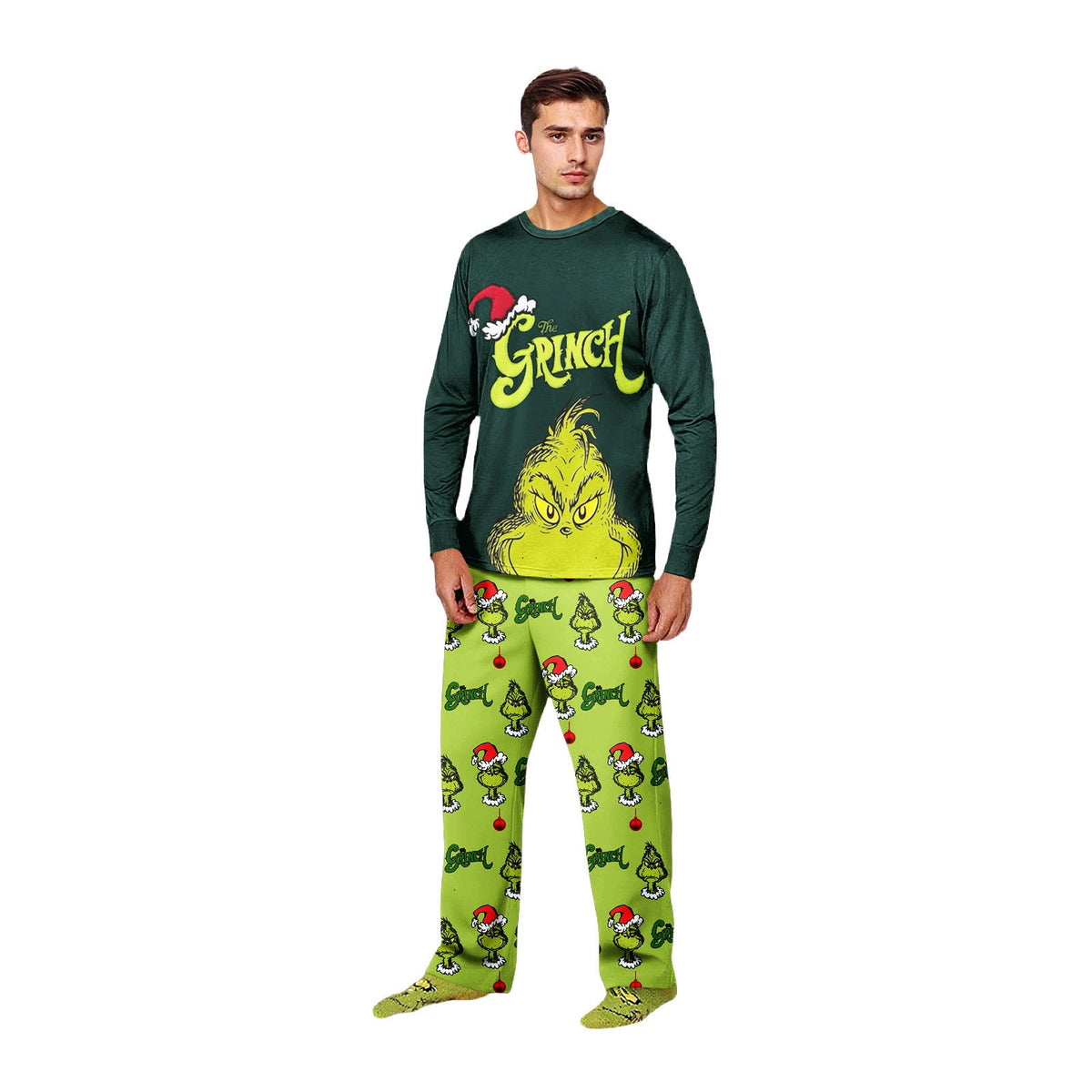 Man wearing a dark green Grinch graphic top and lime-green Christmas pajama pants