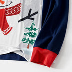Snowman Christmas pajama top showing navy sleeve, red cuff and printed fabric detail