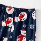Elastic waist and snowman print on navy Christmas pajama pants, close-up
