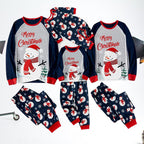 Matching snowman Christmas pajama sets for adults, kids and baby arranged on white