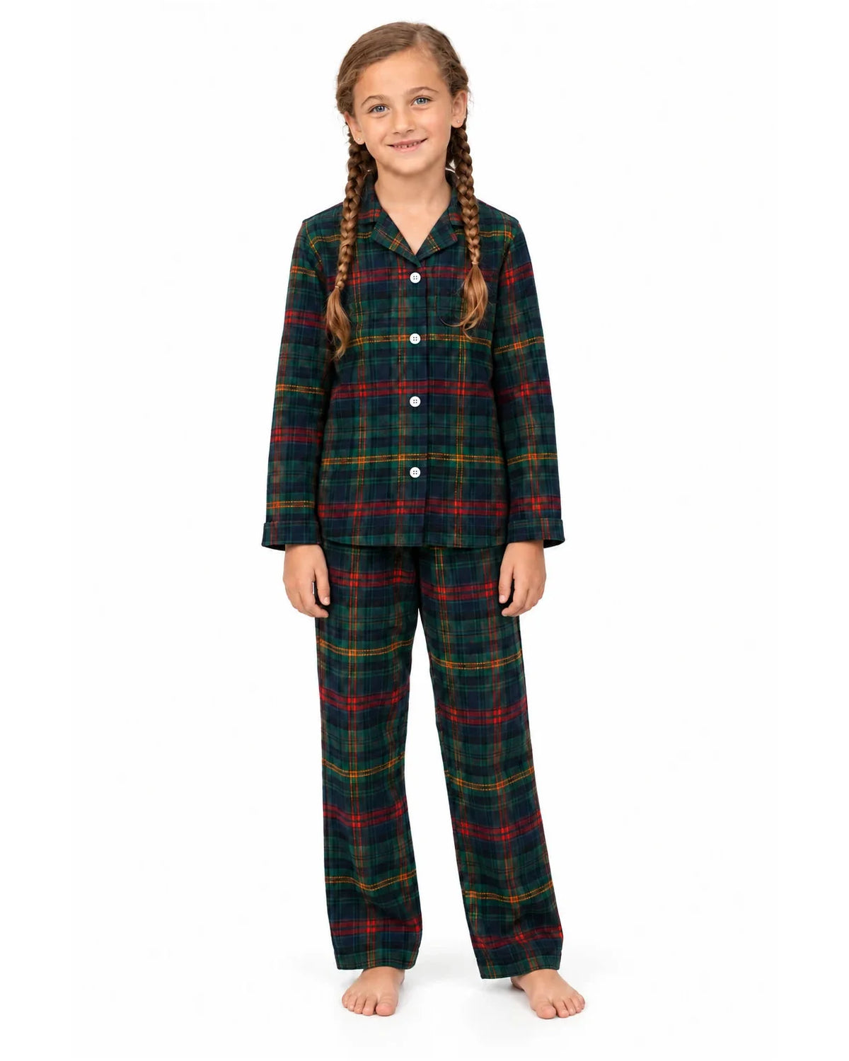 Girl wearing a dark green tartan pajama shirt and long pants on a white background.