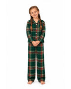 Girl wearing a light green tartan pajama shirt and long pants on a white background.