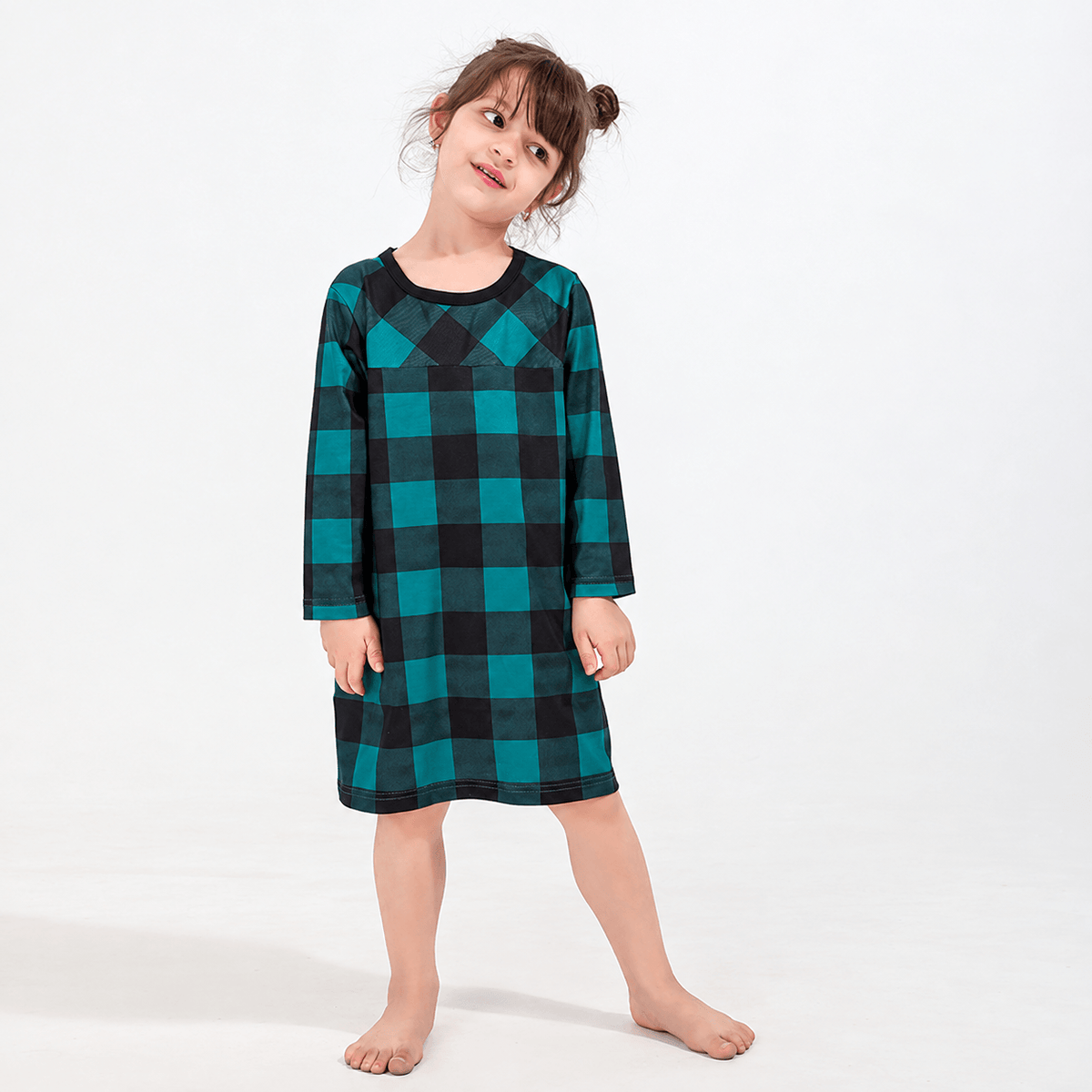 Girl wearing a teal-and-black buffalo check long-sleeve nightdress