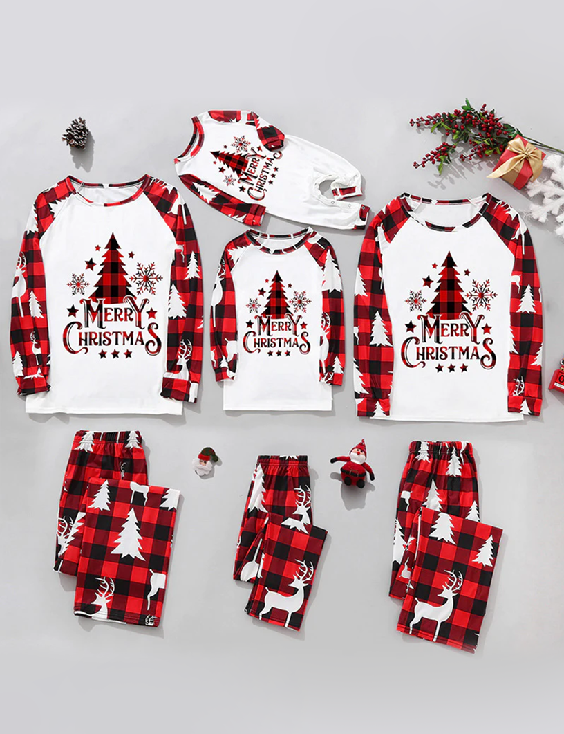Flat lay collection of matching family Christmas pajamas for adults, kids, and baby, featuring red buffalo plaid pants with white reindeer prints and long-sleeve Merry Christmas raglan tops.