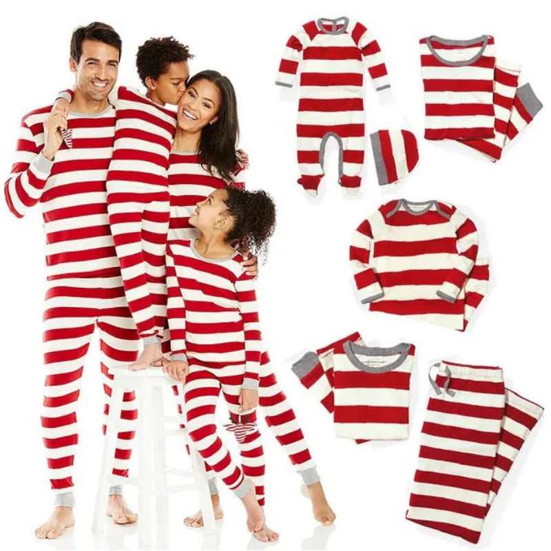 Family of four wearing matching red and white candy cane striped pajamas alongside various size options including baby footie onesie and toddler sets.