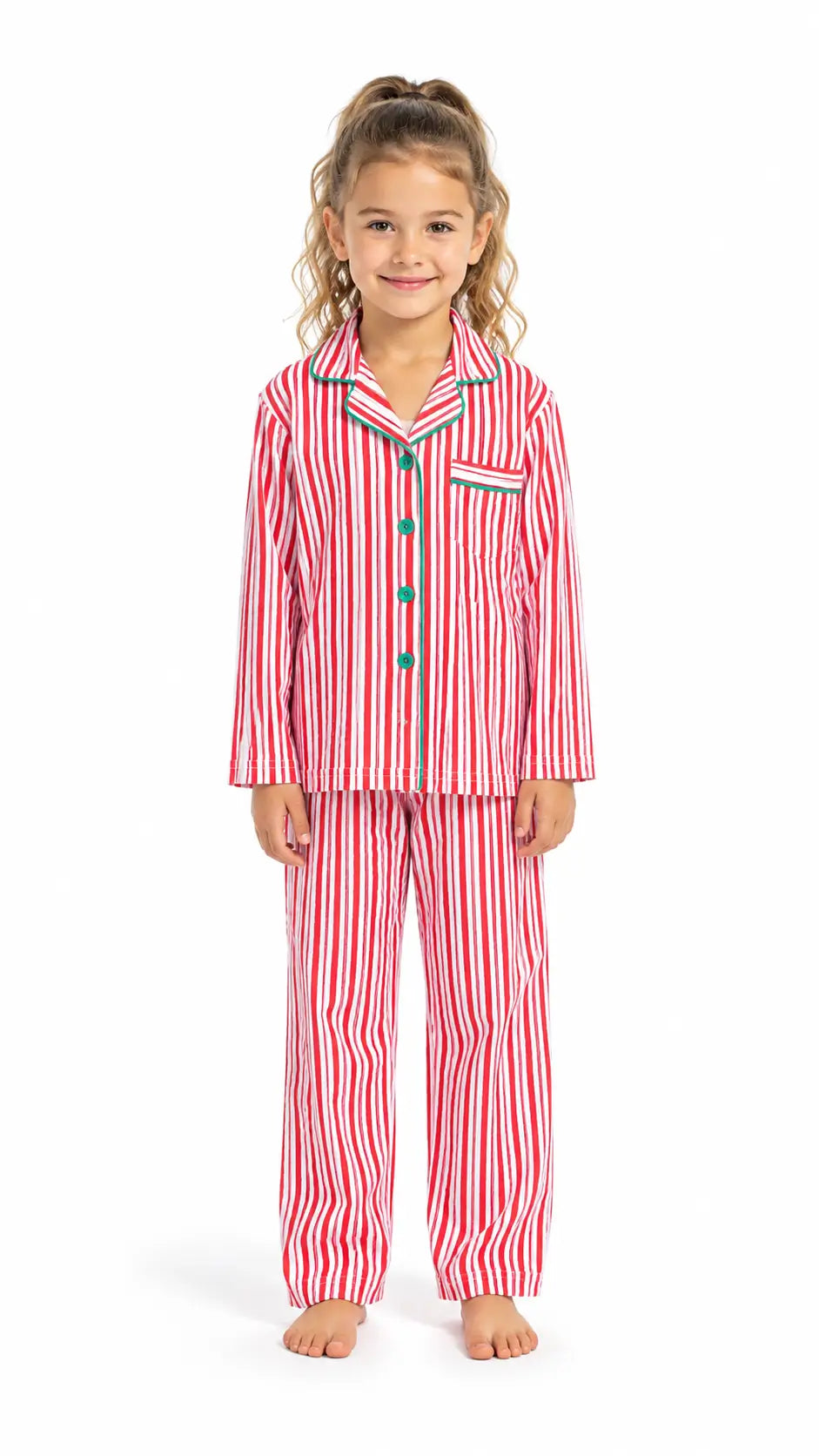 Girl wearing red and white vertical-striped button-up pajamas with green piping and buttons.