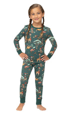 Young girl with braided pigtails modeling a two-piece dark green safari animal print Christmas pajama set.
