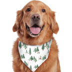 A smiling Golden Retriever wearing a white pet bandana printed with a green watercolor pine tree camping motif, isolated on a white background.