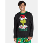 Man wearing a black Merry Grinchmas top with green trim and green Grinch-print pajama pants