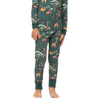 Close-up view of kids dark green Christmas pajama bottoms showing fitted ankle cuffs and holiday animal print.