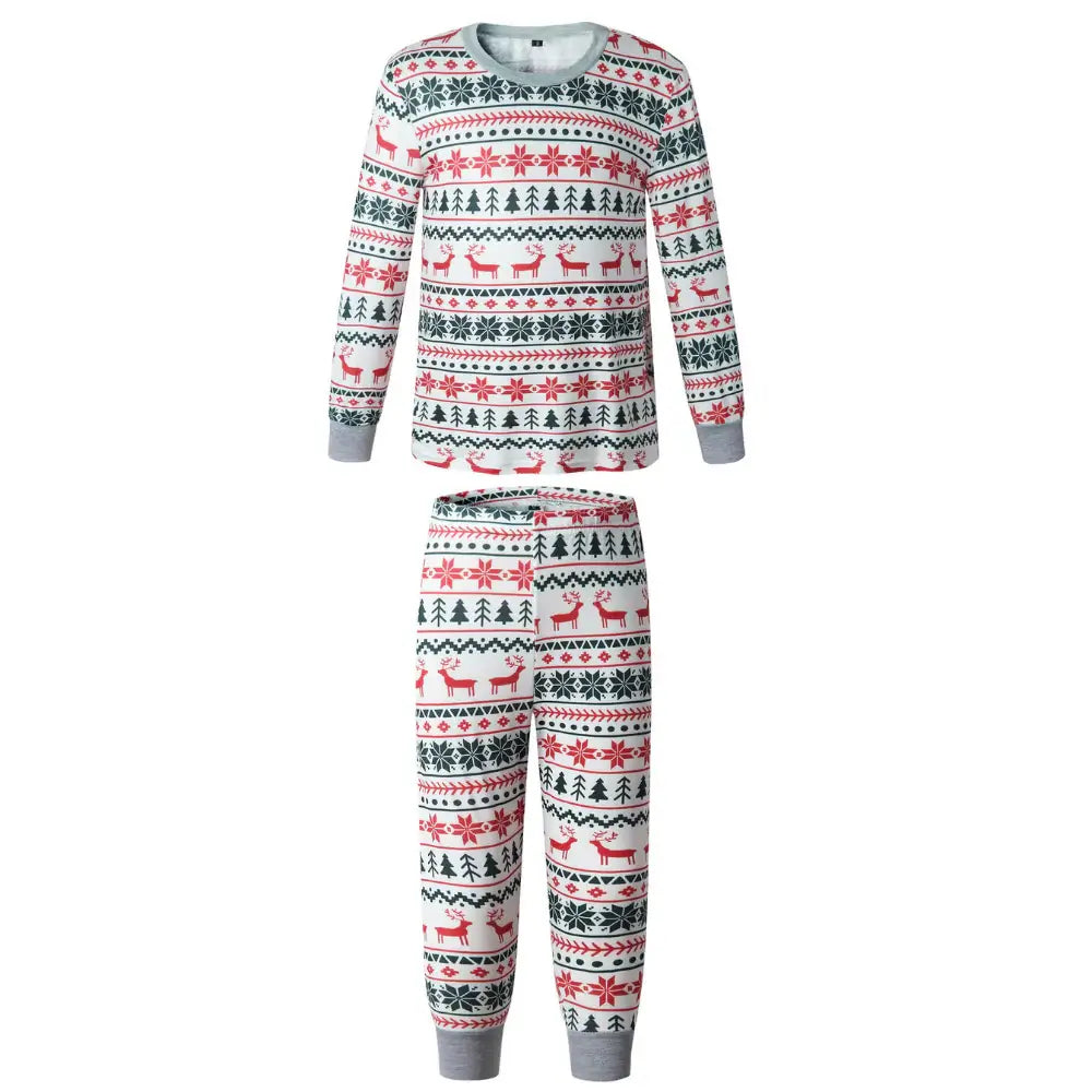 Product shot on white background of a two-piece kids pajama set with red and green Fair Isle reindeer print and grey rib-knit cuffs.