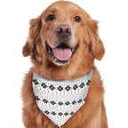 Golden Retriever wearing a matching white Fair Isle snowflake pet bandana scarf for Christmas.