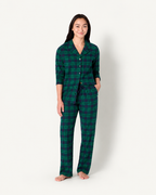 Front view of women's forest green plaid button-front pajama top and long pants.