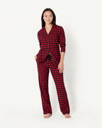 Women's red and black check button-front pajamas with matching drawstring pants.