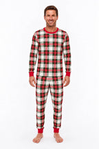 Woman modeling red, white and black plaid Christmas pajamas with a crewneck top and red ankle cuffs.