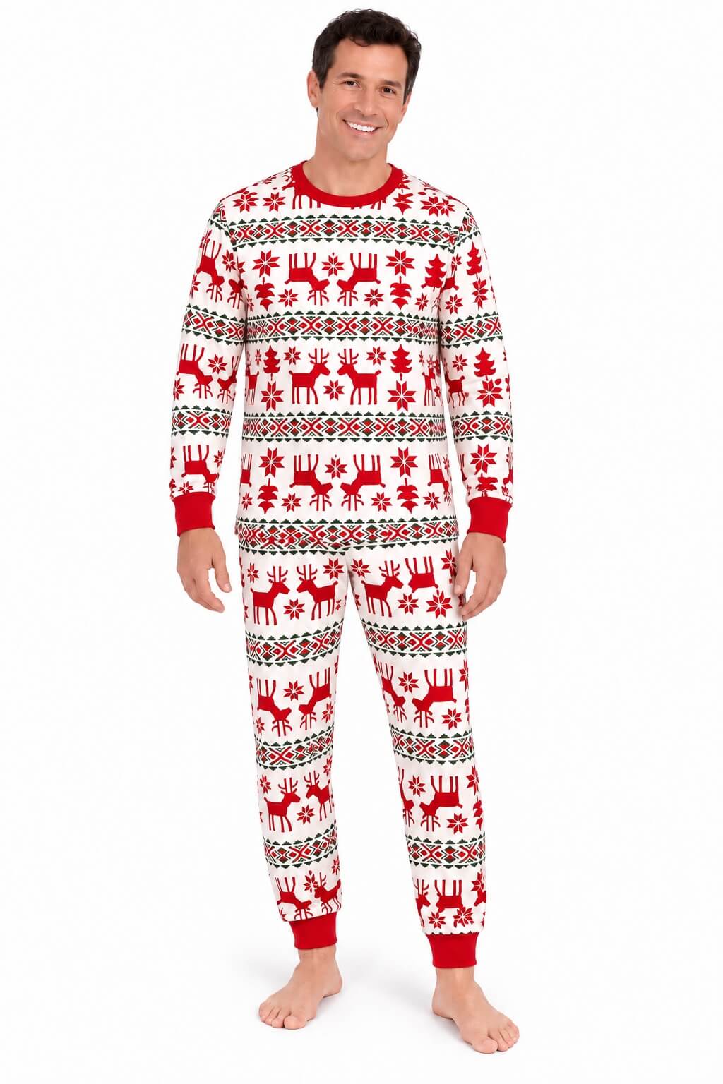 Man wearing white Christmas pajamas with red reindeer and snowflakes, a red crewneck and red cuffs.