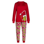 Red Grinch graphic top and striped pajama pants with red ankle cuffs
