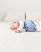 Close view of the blue textured front panel of the Happy Squirrels sleep sack