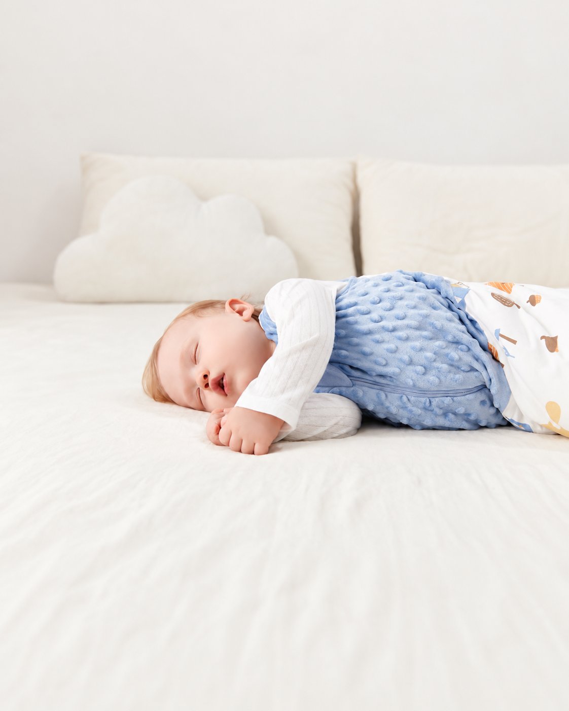 Close view of the blue textured front panel of the Happy Squirrels sleep sack