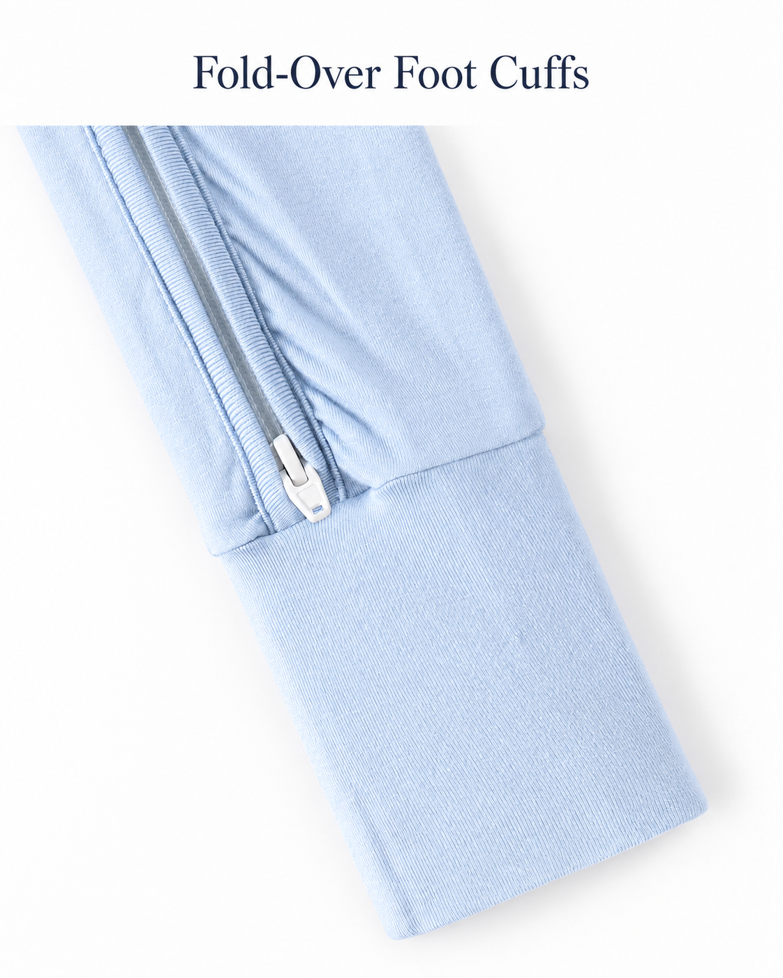Fold-over foot cuff and lower zipper detail on the sky blue baby romper