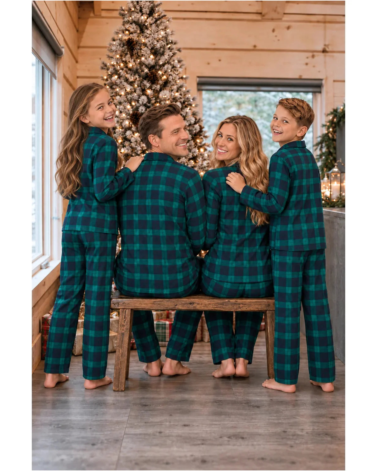 Rear view of a family wearing green and black plaid pajama shirts and pants in a Christmas cabin.