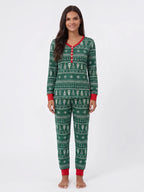 Woman modeling green Fair Isle Christmas pajamas with a red V-neck button placket and red cuffs.